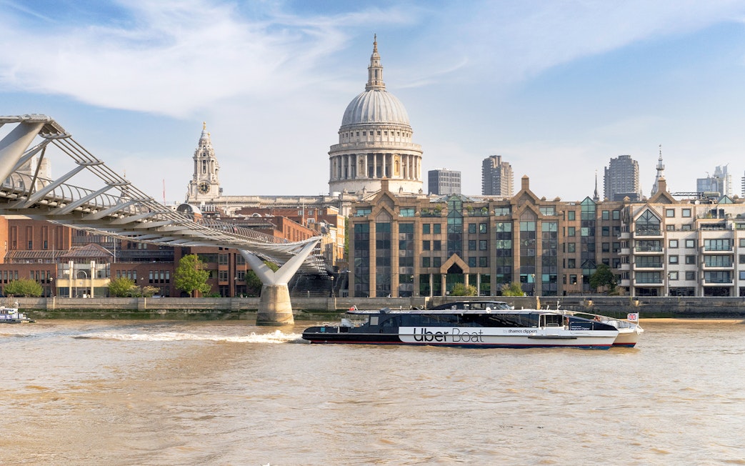 Uber Boat on Thames River near Millennium Bridge, London.