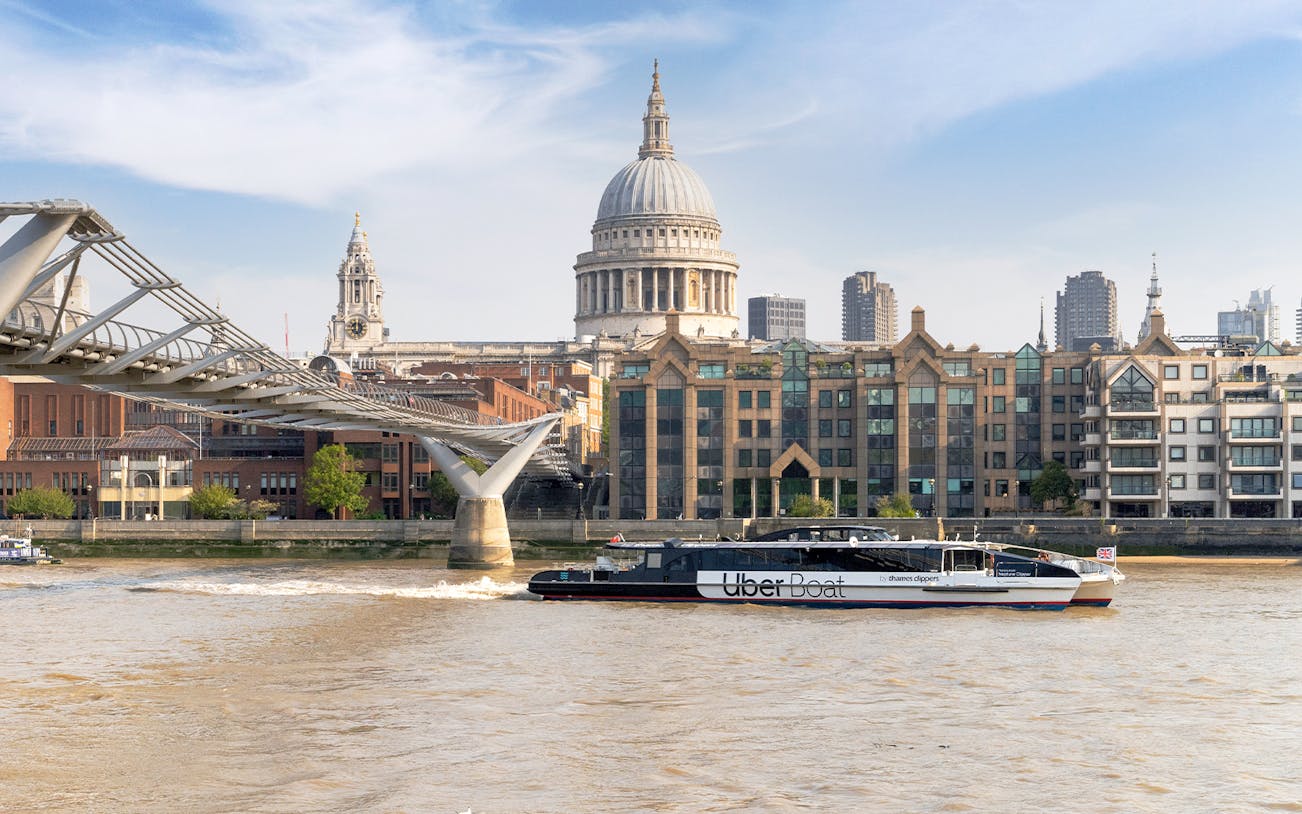 Uber Boat on Thames River near Millennium Bridge, London.