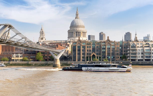 Uber Boat on Thames River near Millennium Bridge, London.