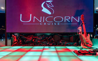 Unicorn Dinner Cruise stage with guitar setup in Bangkok.