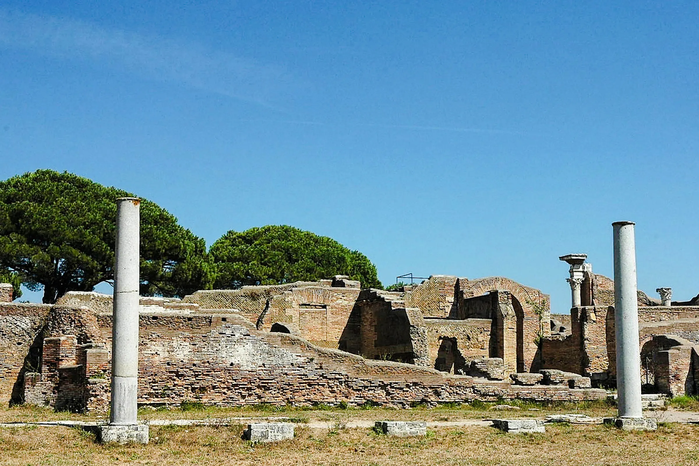 Ostia Antica ruins with ancient columns and brick structures, Rome.