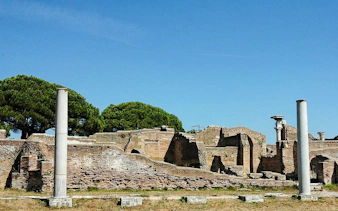 Ostia Antica ruins with ancient columns and brick structures, Rome.