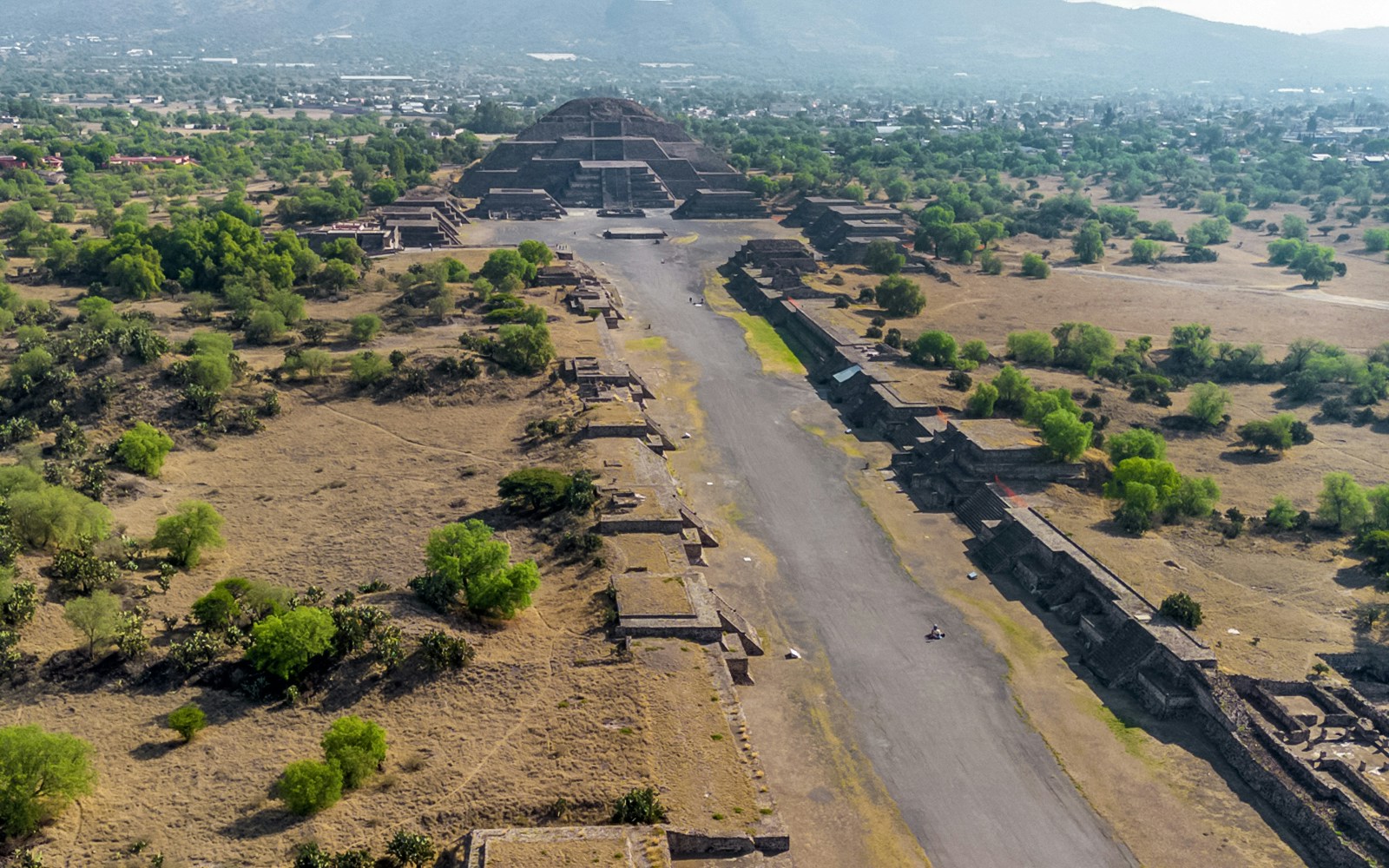 Aerial view of Pyramid of the Moon in Teotihuacan, Mexico, with surrounding ancient structures.