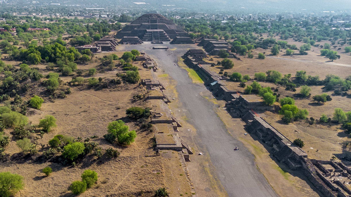 Aerial view of Pyramid of the Moon in Teotihuacan, Mexico, with surrounding ancient structures.