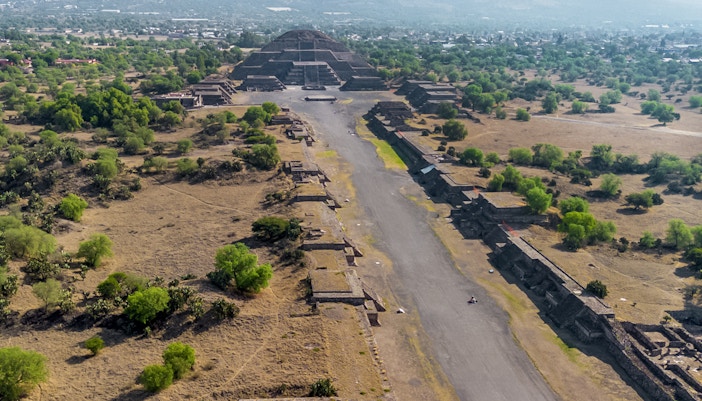 Aerial view of Pyramid of the Moon in Teotihuacan, Mexico, with surrounding ancient structures.