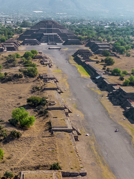 Aerial view of Pyramid of the Moon in Teotihuacan, Mexico, with surrounding ancient structures.