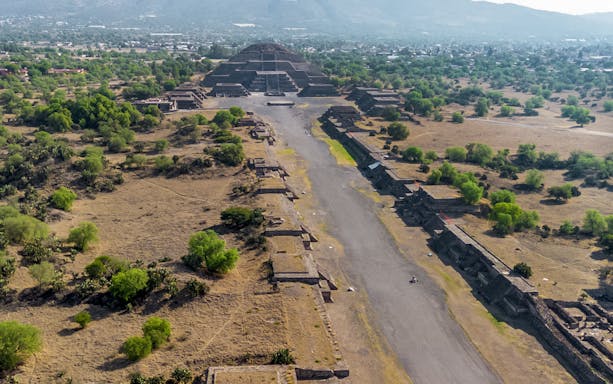 Aerial view of Pyramid of the Moon in Teotihuacan, Mexico, with surrounding ancient structures.