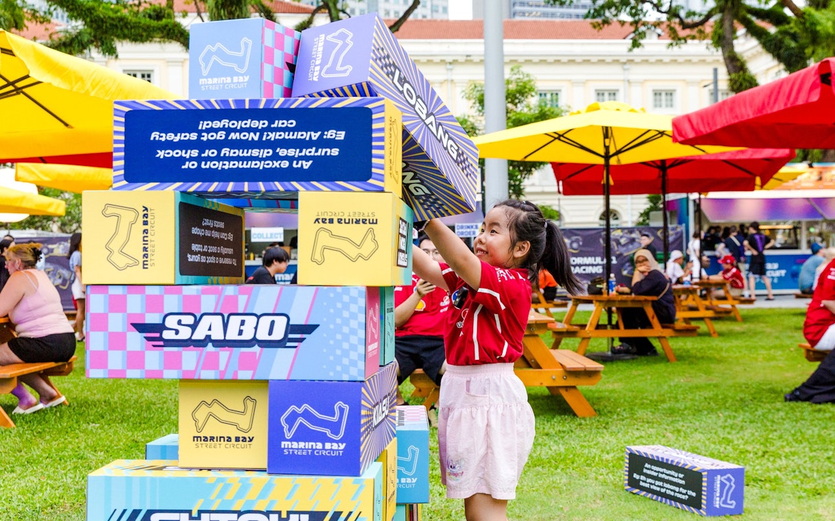 Child playing with large blocks at Marina Bay Street Circuit event, Singapore.