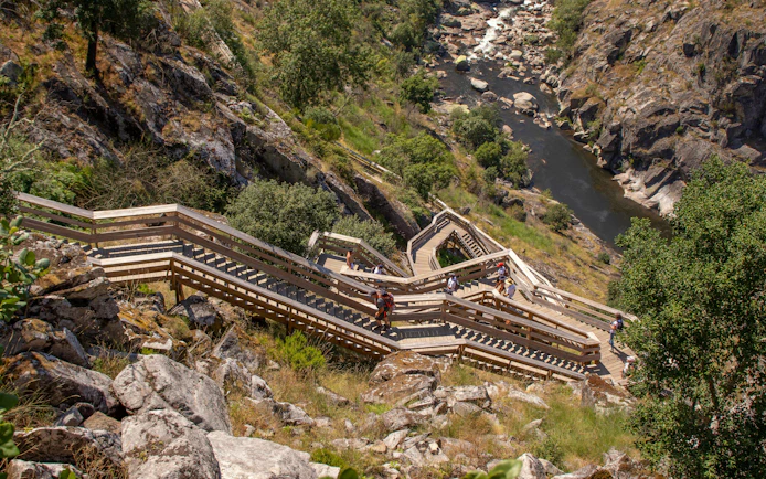 Paiva Walkways wooden stairs along rocky hillside in Arouca, Portugal.