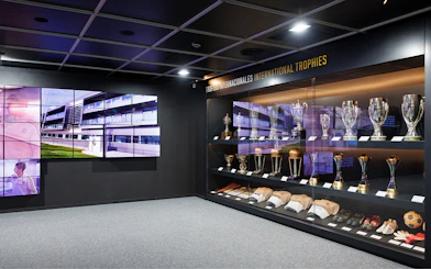 Trophy display inside Santiago Bernabeu Stadium with international awards.