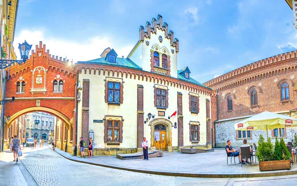 Czartoryski Museum facade with archway and courtyard in Krakow, Poland.