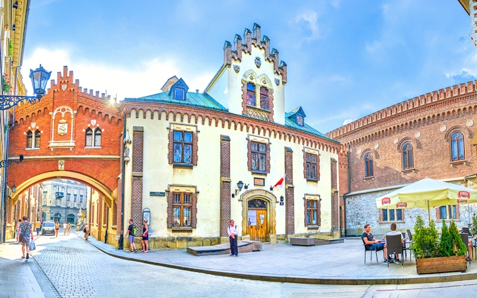 Czartoryski Museum facade with archway and courtyard in Krakow, Poland.