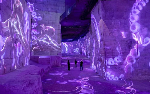 Immersive ocean-themed projections at Carrières des Lumières exhibit in France.