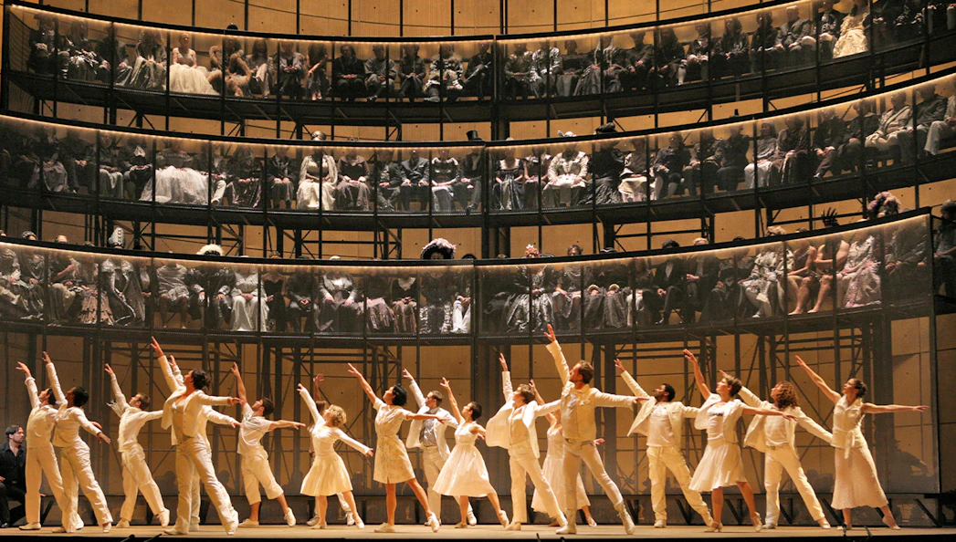 Dancers performing Orfeo ed Euridice on stage with audience in tiered seating.