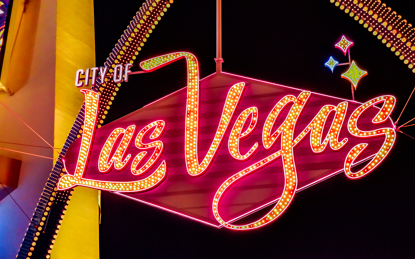 Las Vegas neon sign at night, featured on Big Bus Tours.