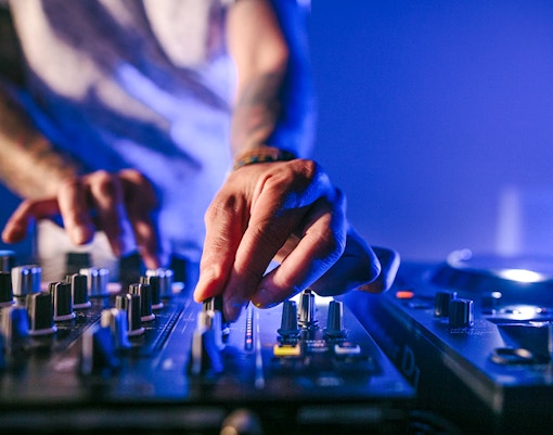 DJ mixing music during Evening Panorama Cruise in Frankfurt.