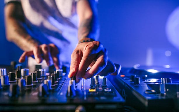DJ mixing music during Evening Panorama Cruise in Frankfurt.