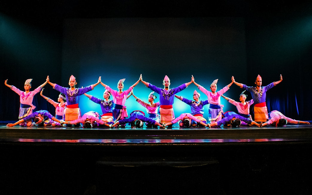 Performers on stage at the Devdan Show in Bali, showcasing traditional Indonesian dance.