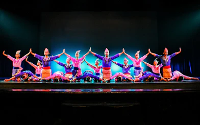 Performers on stage at the Devdan Show in Bali, showcasing traditional Indonesian dance.
