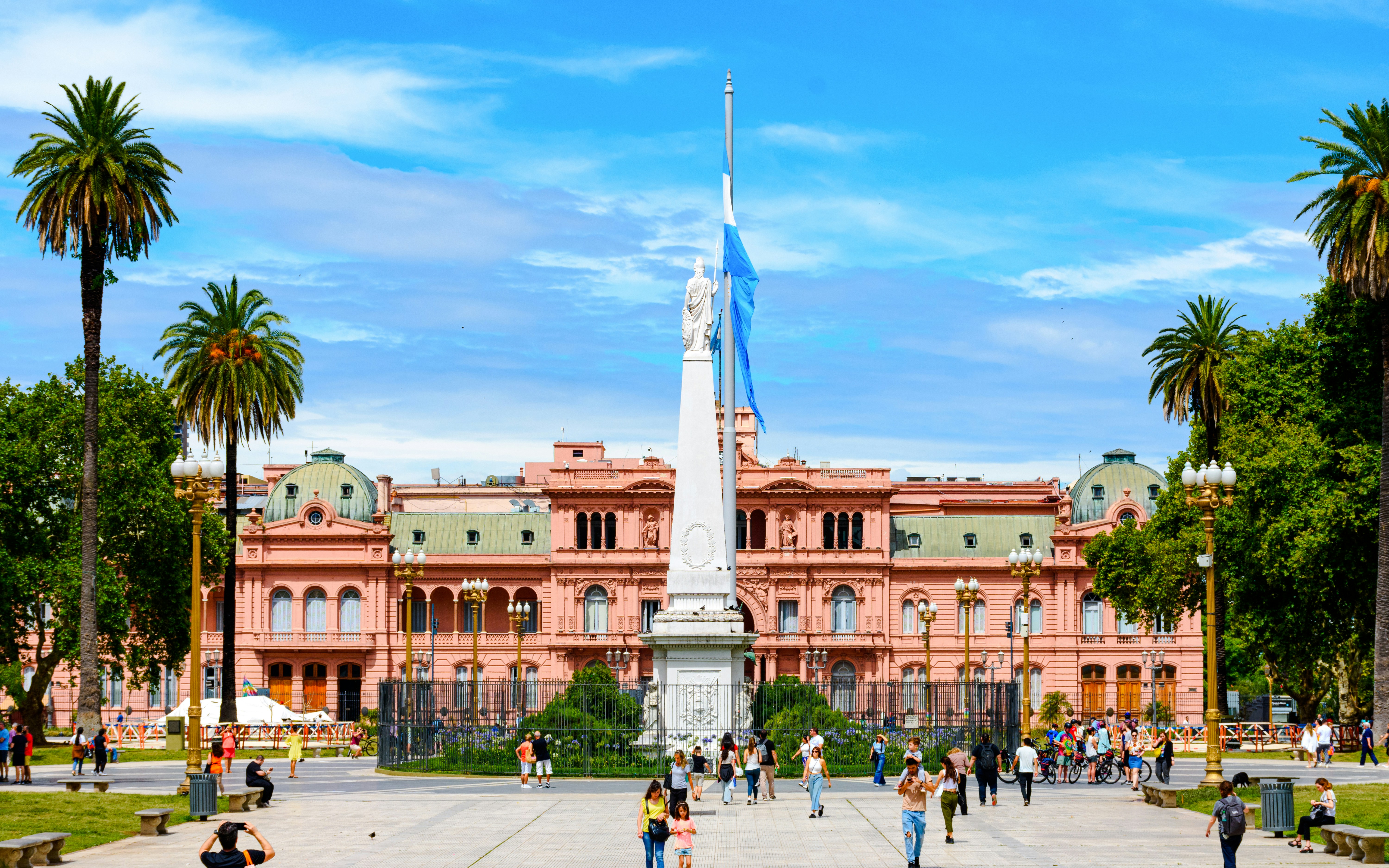 Casa Rosada and Plaza de Mayo with people walking, Buenos Aires.