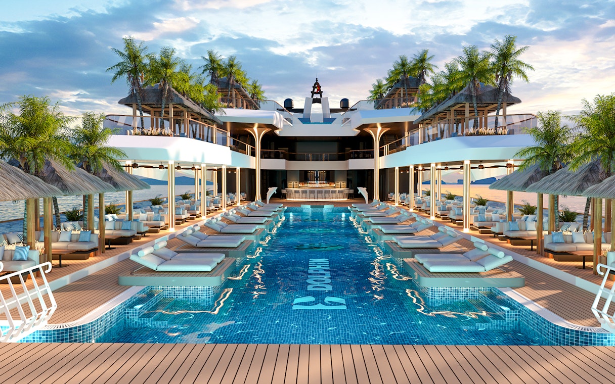 Infinity pool and sun deck on luxury cruise ship at sunset.