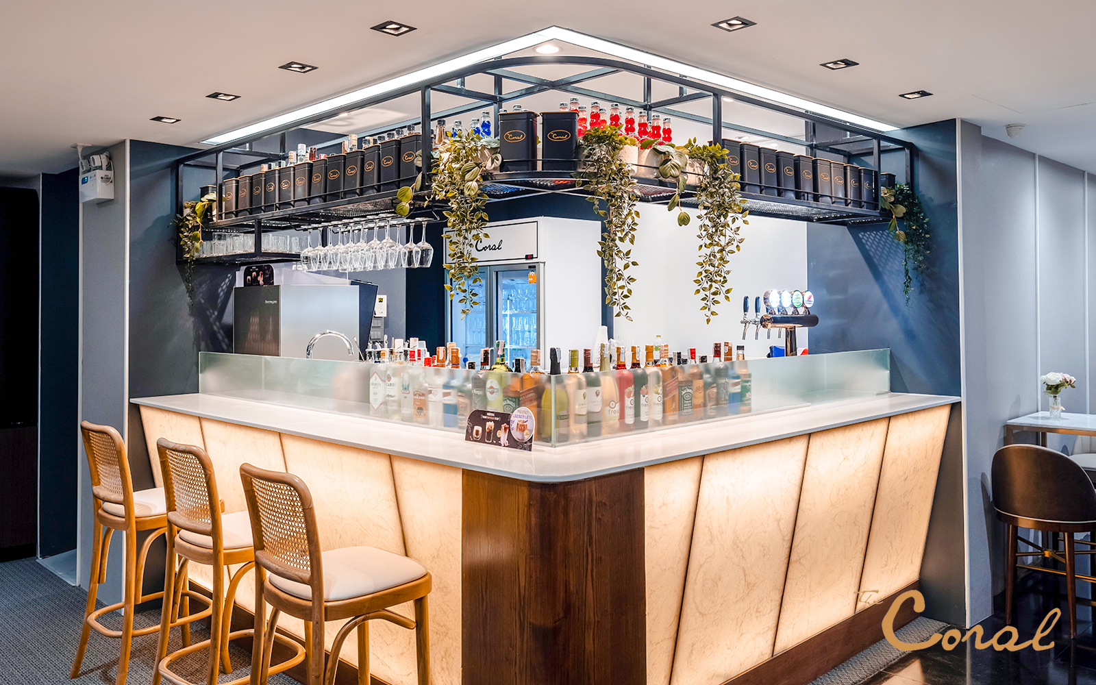 Bar area in Coral Finest Business Class Lounge, Concourse D1, Bangkok airport, featuring drinks and seating.