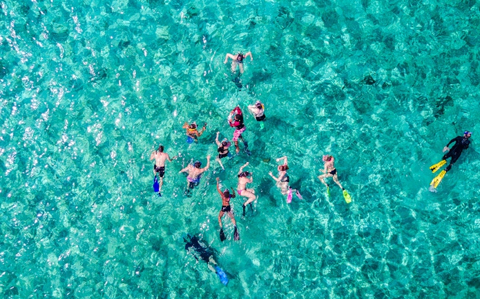 Snorkelers exploring clear waters on Langkawi Island Hopping Cruise.