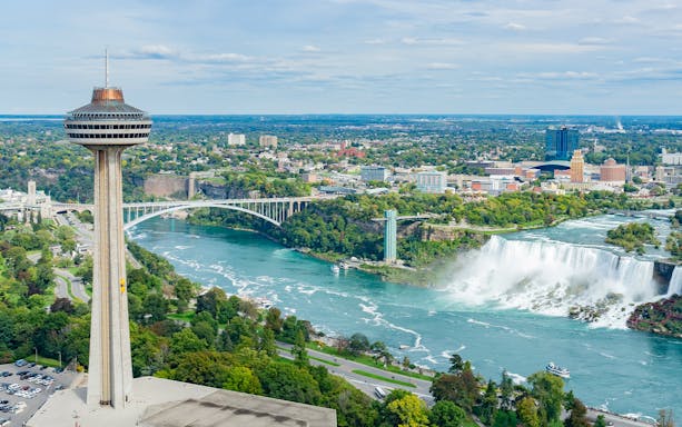 Skylon Tower overlooking Niagara Falls and Rainbow Bridge in Ontario, Canada.