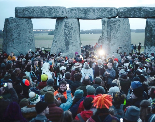 Crowd gathered at Stonehenge for Winter Solstice celebration.