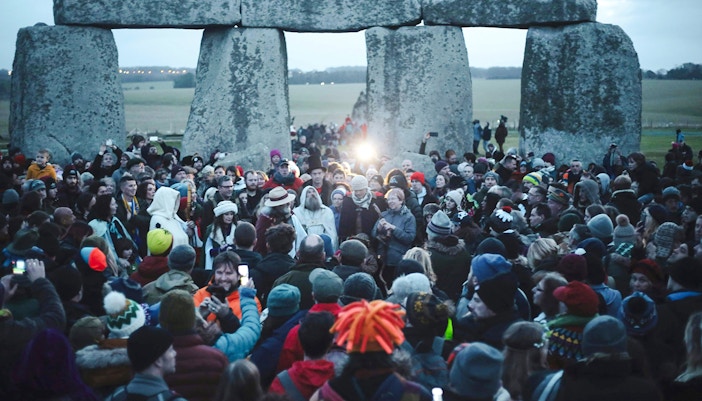 Crowd gathered at Stonehenge for Winter Solstice celebration.