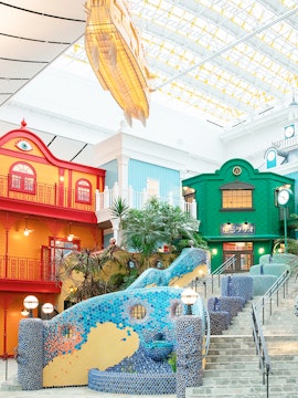 Colorful buildings and mosaic staircase at Ghibli Park, Japan.