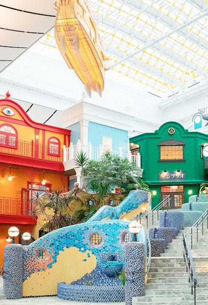 Colorful buildings and mosaic staircase at Ghibli Park, Japan.