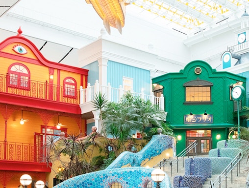 Colorful buildings and mosaic staircase at Ghibli Park, Japan.