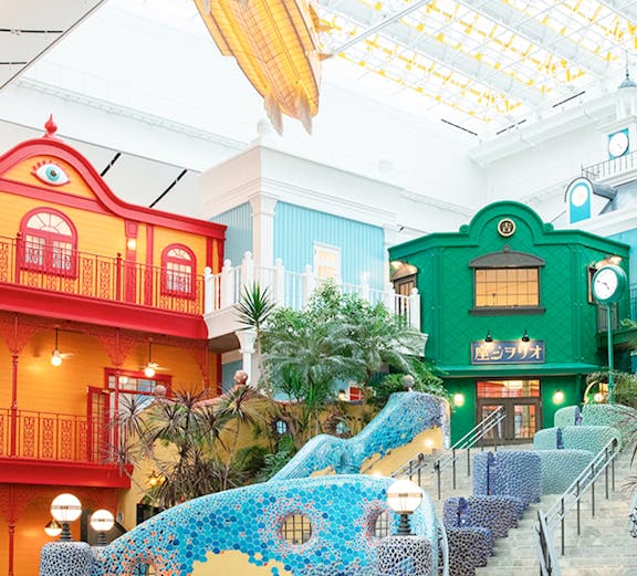 Colorful buildings and mosaic staircase at Ghibli Park, Japan.