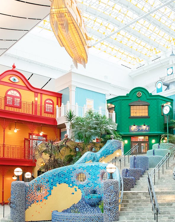 Colorful buildings and mosaic staircase at Ghibli Park, Japan.