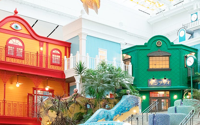 Colorful buildings and mosaic staircase at Ghibli Park, Japan.