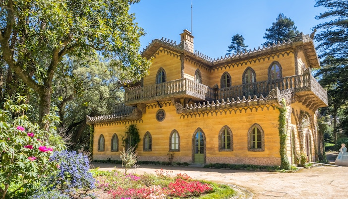Chalet da Condessa of Edla surrounded by gardens in Pena Park, Sintra, Portugal.