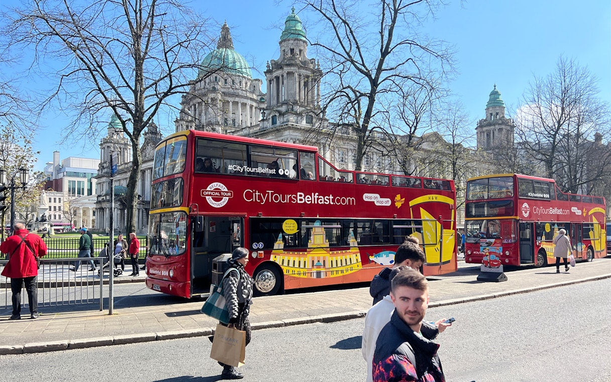 Hop-on hop-off bus in front of Belfast City Hall.