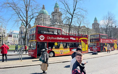 Hop-on hop-off bus in front of Belfast City Hall.