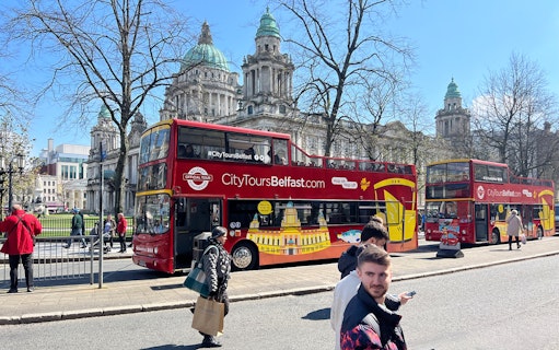 Hop-on hop-off bus in front of Belfast City Hall.