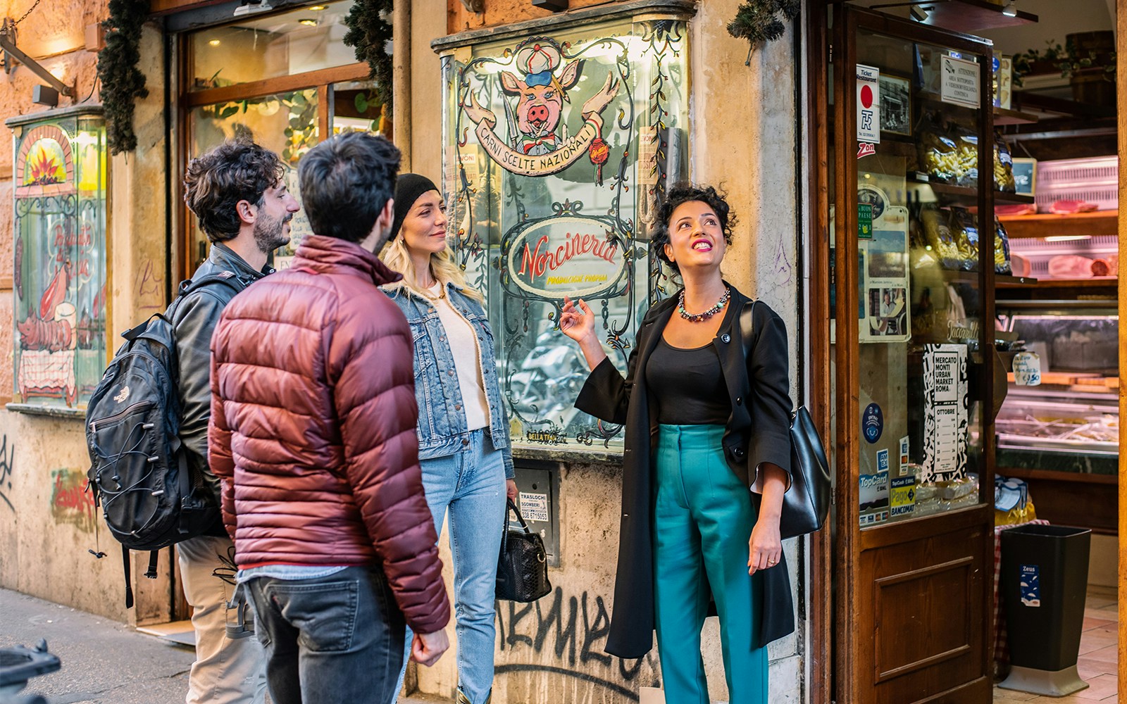 Trastevere Rome food tour with guide exploring local market stalls.