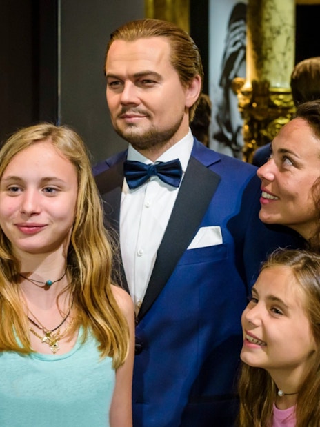 Visitors taking a selfie with a wax figure at Grévin Paris Wax Museum.