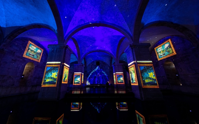 Visitors at Immersivus Gallery Lisbon viewing Monet and Klimt light and sound show.