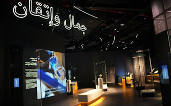 Exhibit at Light & Peace Museum, Sheikh Zayed Grand Mosque Centre, featuring illuminated displays and artifacts.