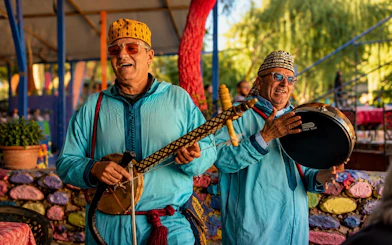 Musicians playing traditional instruments in Marrakech's Ourika Valley.
