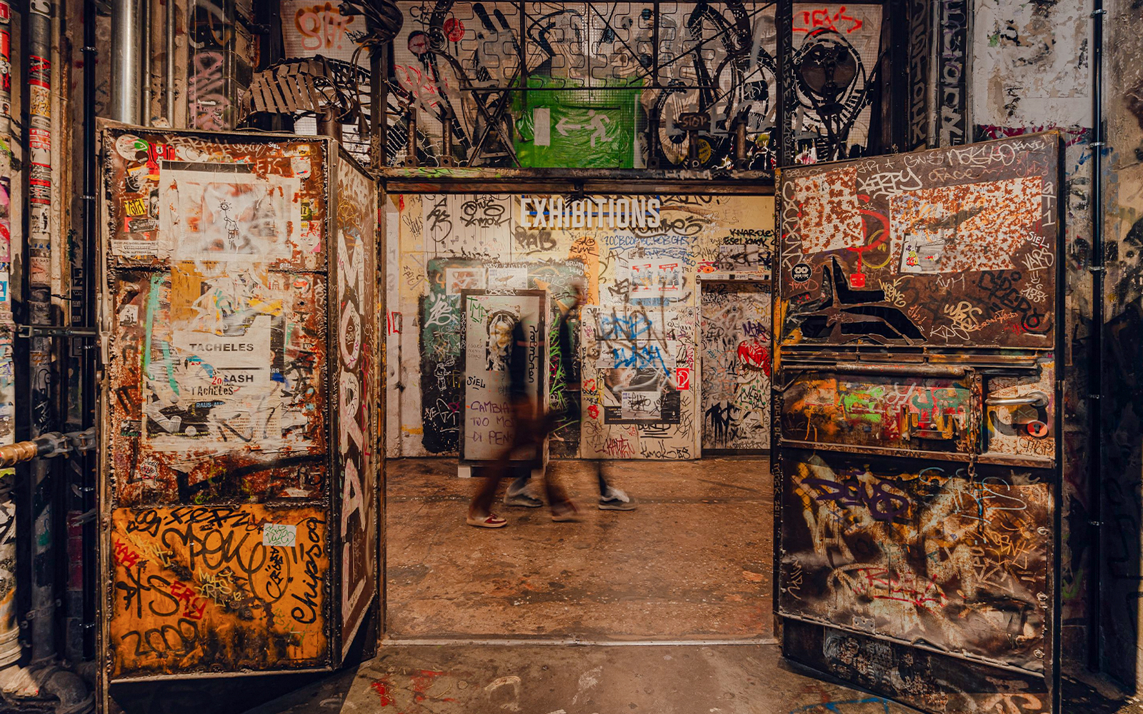 Graffiti-covered entrance to an exhibition at Fotografiska Berlin.