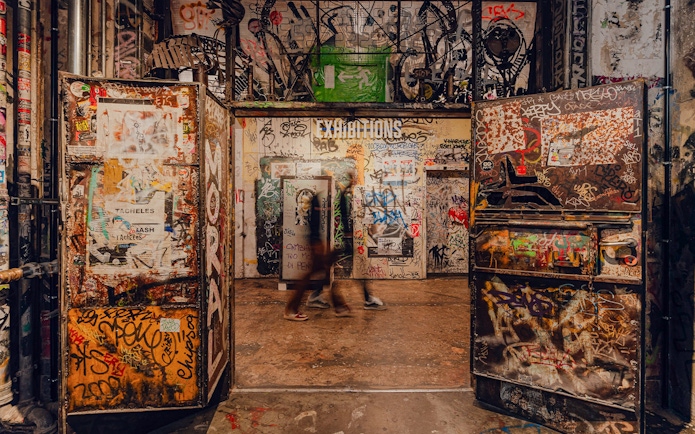 Graffiti-covered entrance to an exhibition at Fotografiska Berlin.