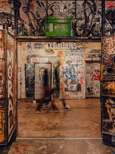 Graffiti-covered entrance to an exhibition at Fotografiska Berlin.