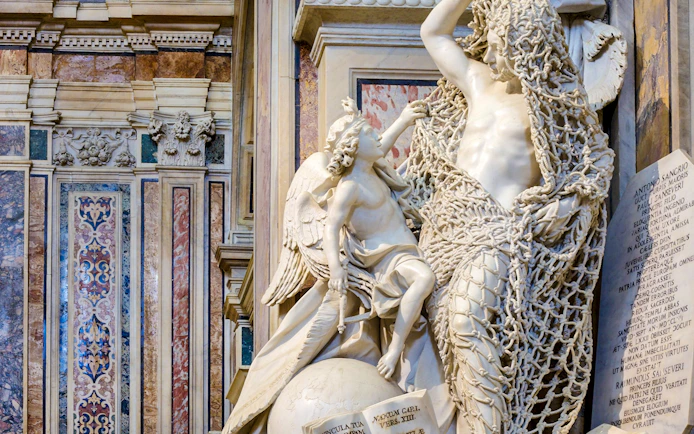Statue of angel and veiled figure in Sansevero Chapel, Naples.