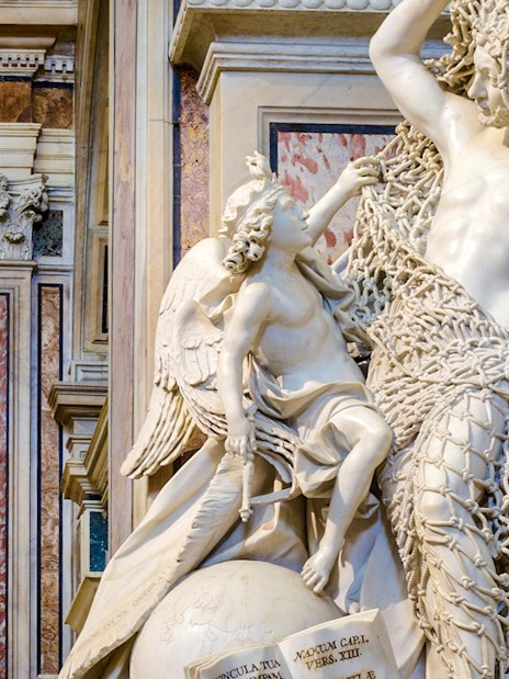 Statue of angel and veiled figure in Sansevero Chapel, Naples.